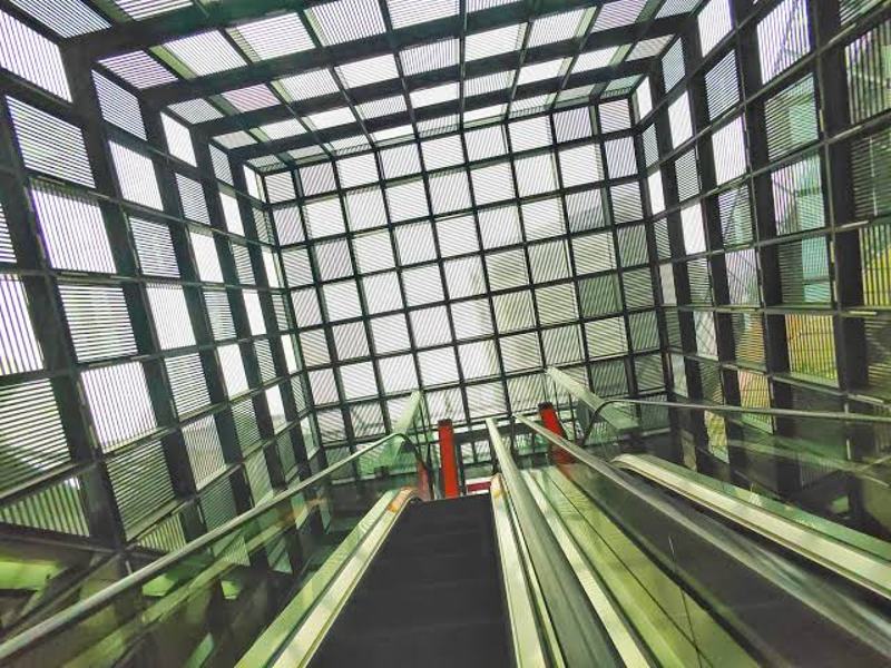 Glass-roofed escalator up to the roof level