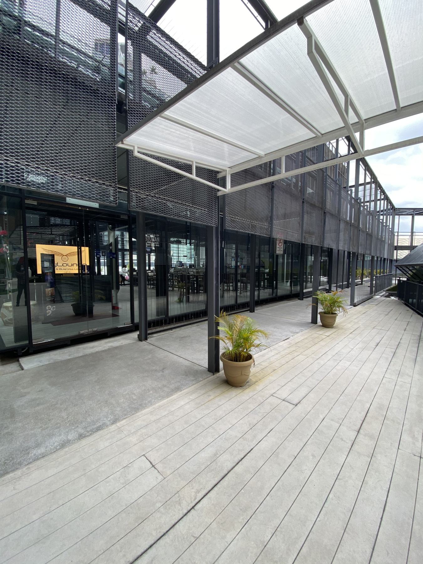 Covered terrace beside the glasshouse