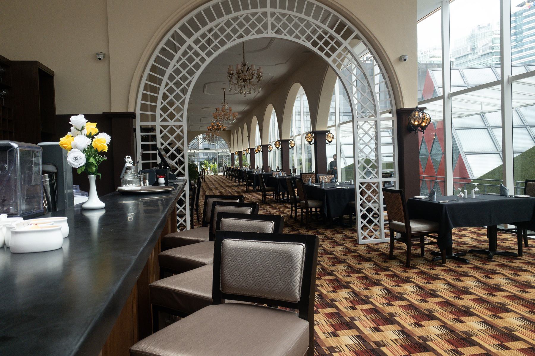 Lattice archway and tables in the dining hall